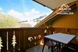Enjoy breathtaking mountain views from this charming balcony.