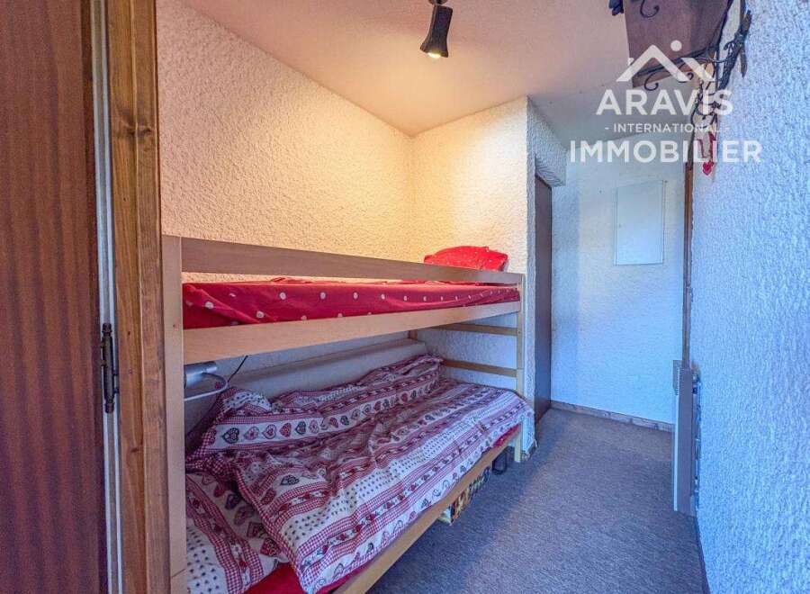 Discover this charming property featuring a cozy bunk bed, perfect for accommodating guests or family.