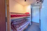 Discover this charming property featuring a cozy bunk bed, perfect for accommodating guests or family.