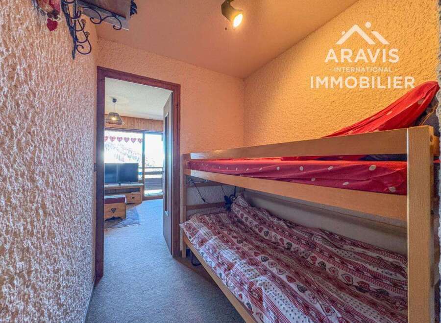 Discover this charming property featuring a cozy bunk bed setup, perfect for accommodating guests or family.