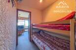 Discover this charming property featuring a cozy bunk bed setup, perfect for accommodating guests or family.