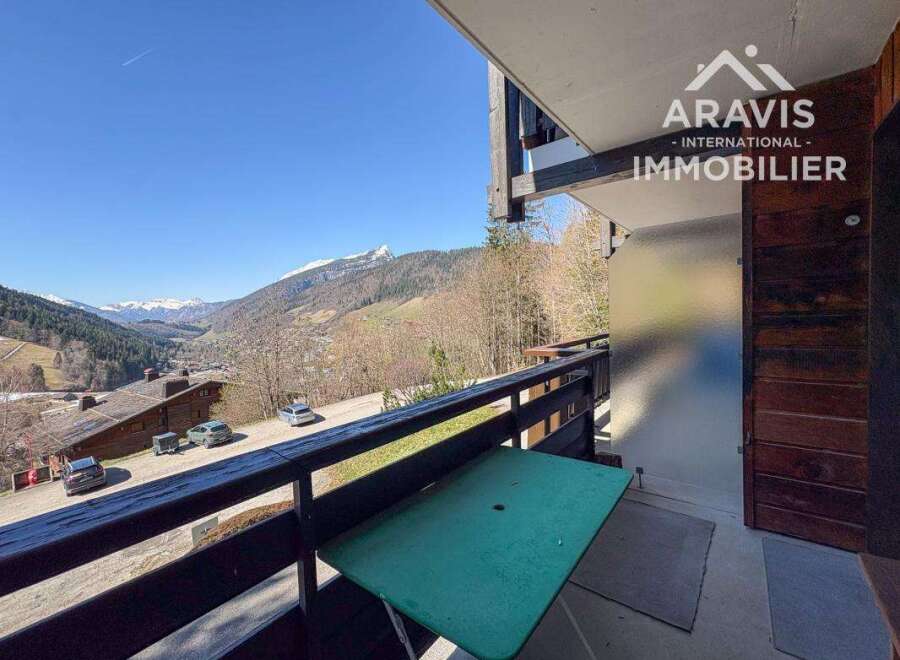 Enjoy breathtaking mountain views from this charming balcony.