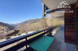 Enjoy breathtaking mountain views from this charming balcony.