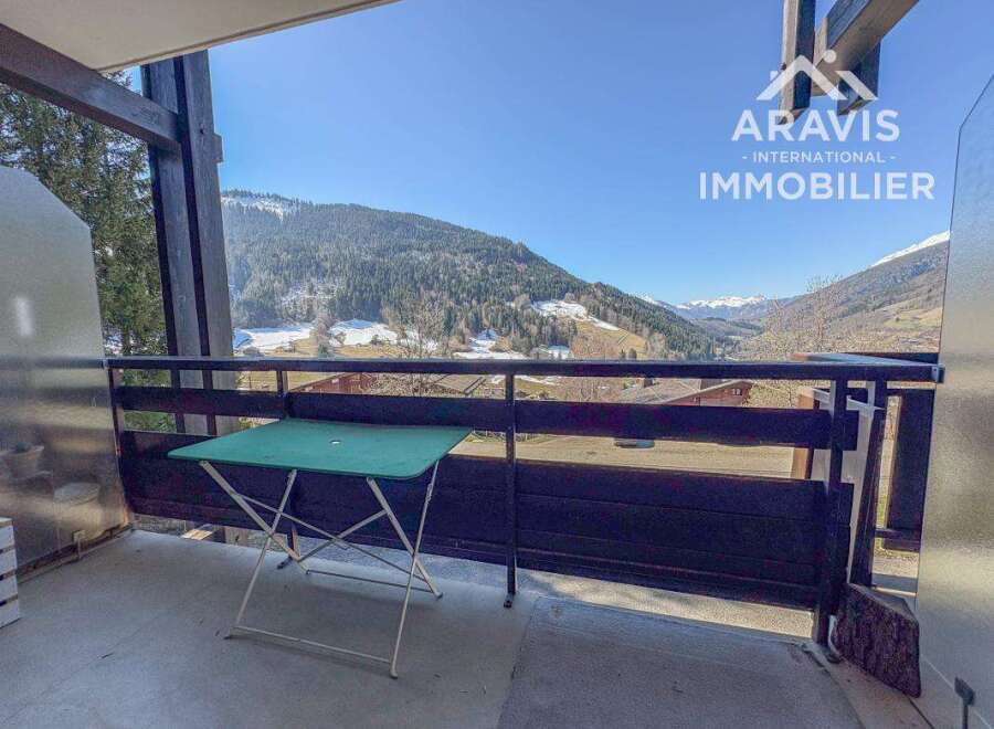 Enjoy breathtaking mountain views from this charming balcony.