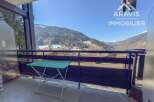 Enjoy breathtaking mountain views from this charming balcony.