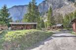 Nestled in a serene mountain setting, this charming property offers a unique blend of rustic charm and natural beauty.