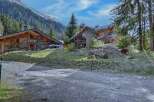 Discover the charm of this stunning wooden chalet nestled in a picturesque mountain setting.
