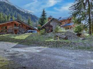 Discover the charm of this stunning wooden chalet nestled in a picturesque mountain setting.