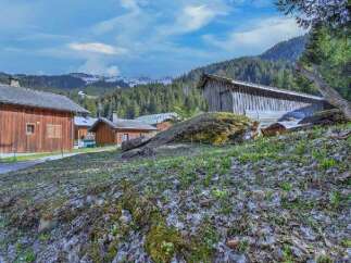 Nestled in a picturesque mountain setting, this charming property offers a tranquil escape.