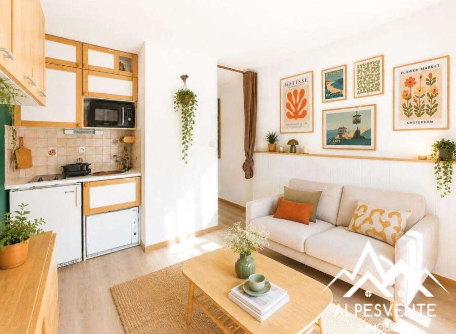 Discover this charming studio apartment featuring a compact, well-equipped kitchenette with modern appliances and ample storage.