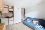 Discover this charming studio apartment featuring a compact kitchenette equipped with a microwave and refrigerator, perfect for preparing simple meals.