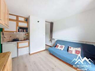 Discover this charming studio apartment featuring a compact kitchenette equipped with a microwave and refrigerator, perfect for preparing simple meals.