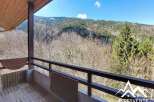 Enjoy breathtaking mountain views from this charming balcony.