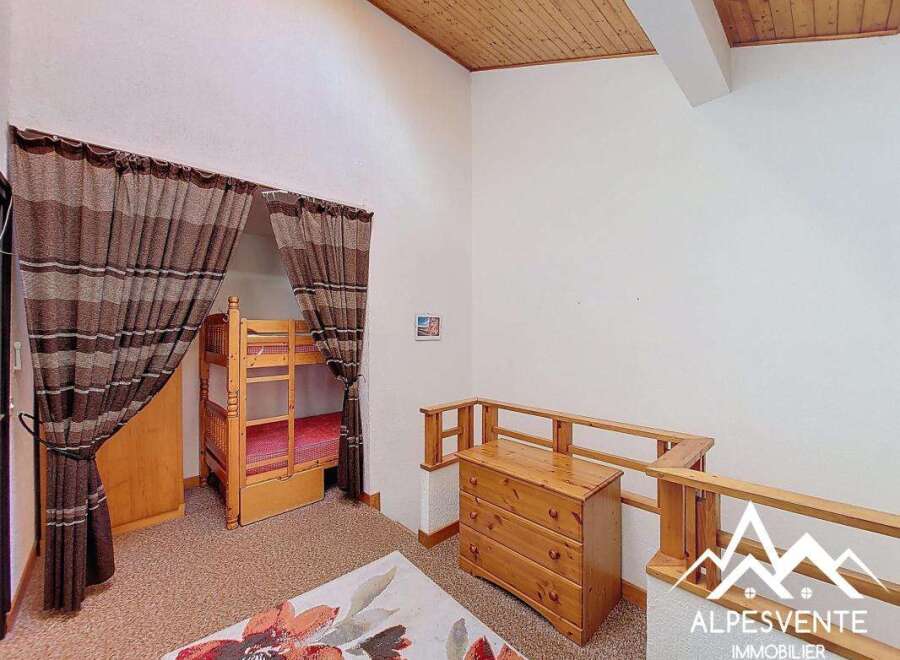 Discover this charming property featuring a cozy bunk bed setup, perfect for accommodating guests or family.