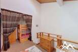 Discover this charming property featuring a cozy bunk bed setup, perfect for accommodating guests or family.