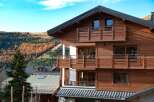 This stunning wooden chalet offers a perfect blend of rustic charm and modern comfort.