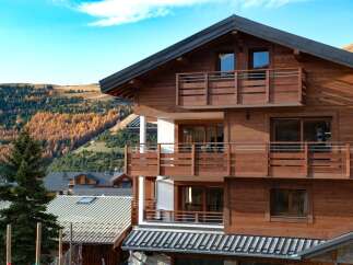This stunning wooden chalet offers a perfect blend of rustic charm and modern comfort.