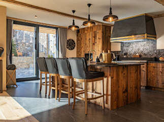 This stunning kitchen boasts a rustic yet modern design, perfect for entertaining and everyday living.