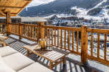 Enjoy breathtaking mountain views from this luxurious balcony.