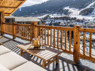 Enjoy breathtaking mountain views from this luxurious balcony.