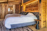 Experience the epitome of rustic luxury in this stunning bedroom.
