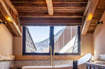 Experience luxury living in this stunning property, featuring a spa-like bathroom with breathtaking mountain views.
