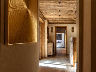 Step into luxury with this stunning property, showcasing exquisite wooden details and a warm, inviting ambiance.