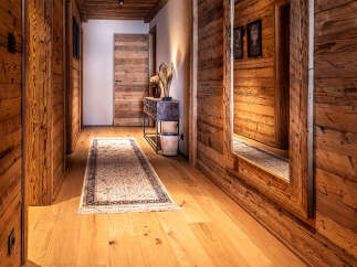 Step into rustic elegance with this stunning hallway.