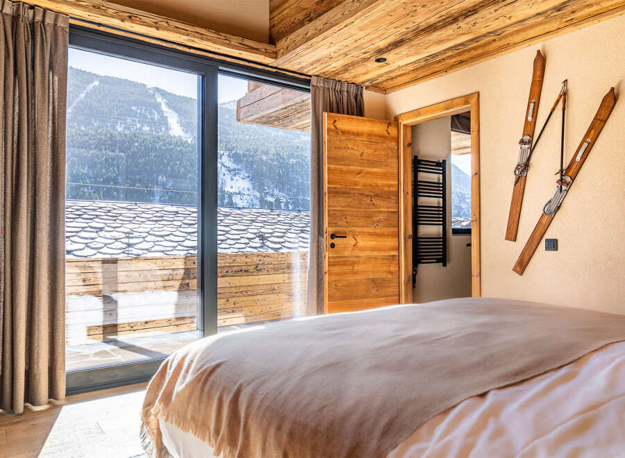 Experience the ultimate mountain retreat in this stunning bedroom.