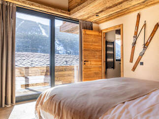 Experience the ultimate mountain retreat in this stunning bedroom.