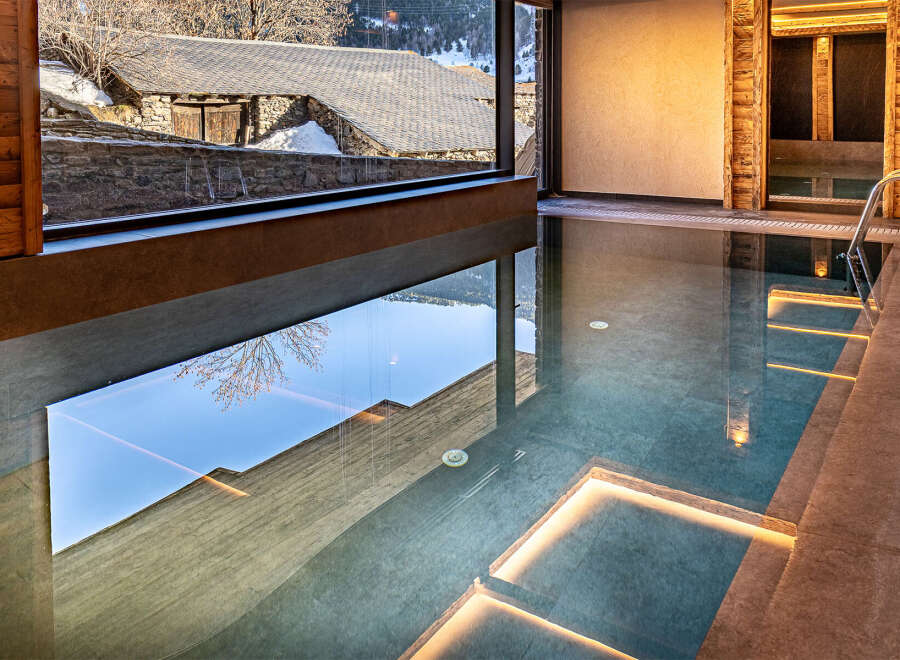 Indulge in luxury with this stunning indoor pool, offering a serene escape with breathtaking views.