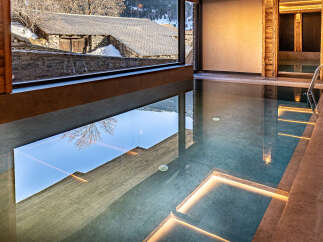 Indulge in luxury with this stunning indoor pool, offering a serene escape with breathtaking views.