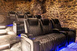 Step into luxury with this stunning home theater! Featuring plush, diamond-stitched leather seating and ambient blue lighting, this space is designed for ultimate comfort and entertainment.