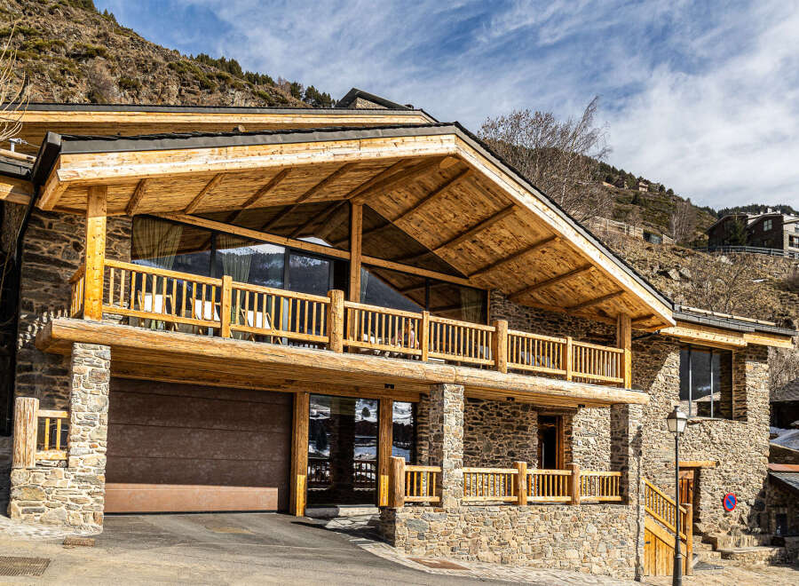 This stunning mountain home boasts a unique blend of rustic charm and modern design.