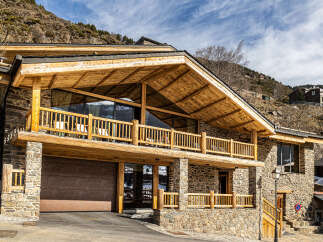 This stunning mountain home boasts a unique blend of rustic charm and modern design.