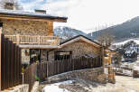 Discover the charm of this stunning stone-clad property nestled in a picturesque mountain setting.