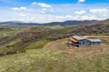 Nestled in a picturesque mountain landscape, this stunning property offers unparalleled views and tranquility.