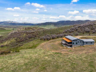 Nestled in a picturesque mountain landscape, this stunning property offers unparalleled views and tranquility.