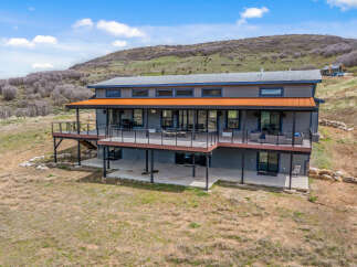 Discover modern living in this stunning home, perfectly situated in a serene natural setting.