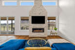 Experience luxury living in this stunning property featuring a modern fireplace and expansive windows.