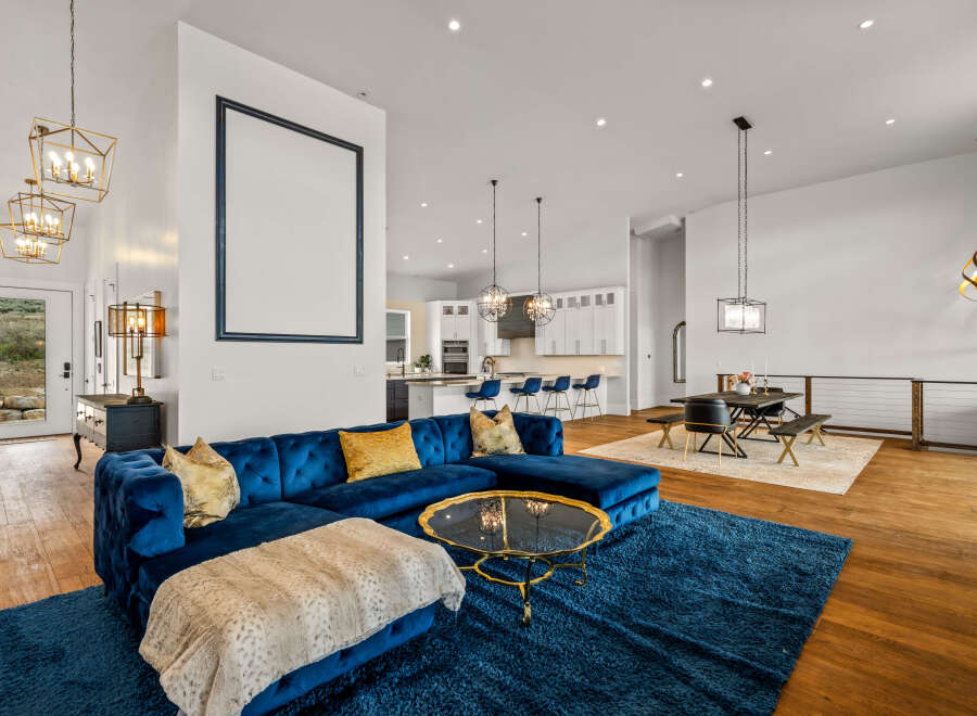 Step into luxury with this stunning property, showcasing a spacious open-concept living area.