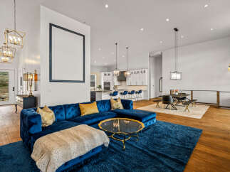 Step into luxury with this stunning property, showcasing a spacious open-concept living area.