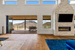 Experience luxury living in this stunning property featuring a modern fireplace and a spacious open-concept design.