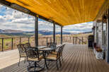 Enjoy breathtaking mountain views from this stunning outdoor deck.