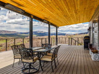 Enjoy breathtaking mountain views from this stunning outdoor deck.