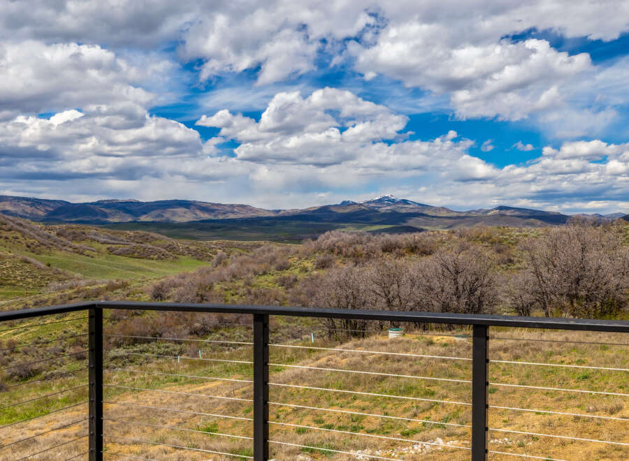 Enjoy breathtaking mountain views from this stunning property! This home offers a serene escape with its expansive outdoor space and modern design.