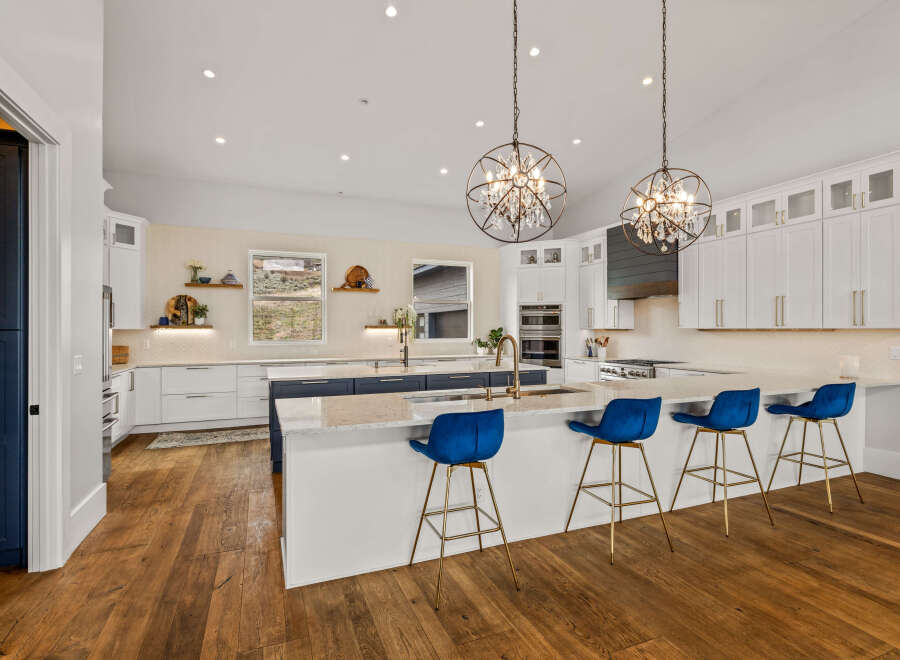 This stunning kitchen boasts a modern design with a large island, perfect for entertaining.