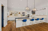 This stunning kitchen boasts a modern design with a large island, perfect for entertaining.