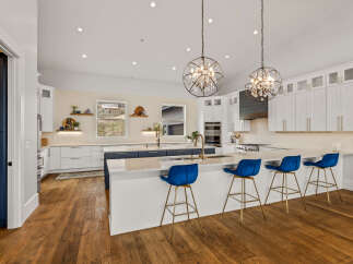 This stunning kitchen boasts a modern design with a large island, perfect for entertaining.