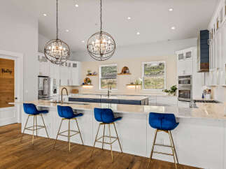 This stunning kitchen boasts a modern design with high-end finishes.